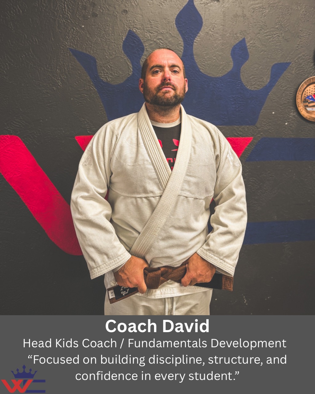 Coach David’s supplied profile card, showing him in a white gi and brown belt. The role and statement on the card are repeated below.
